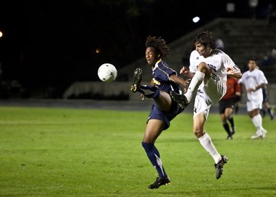 <strong>SCOTT ROEDER |</strong> Staff Photographer<br>Amani Walker displays his can-can skills while battling a UCR defender for control of the ball. UCI won 4-2.