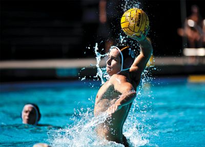 <strong>SCOTT ROEDER |</strong> Staff Photographer<br>Junior Doug Lindsey rises above the water to fire a shot on goal, en route  to three straight wins for UCI.