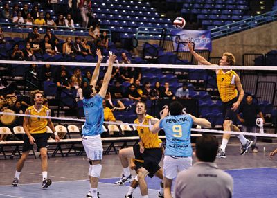 <strong>NICHOLAS VU |</strong> Staff Photographer<br>Junior outside hitter Jordan DuFault tips the ball against Drean Bolivar of Argentina.