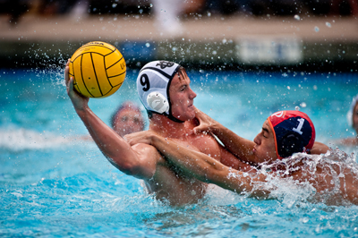 <strong>SCOTT ROEDER |</strong> Staff Photographer<br>Senior UCI 2-meter Greg Enloe remains calm with the ball despite being bedeviled by a Princeton defender.