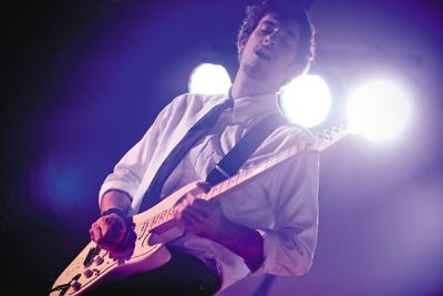 <strong>MELISSA LEE |</strong> Staff Photographer<br>A member of “The Vespertines” rocks out onstage at the Fourth Annual Antstock in Crystal Cove last Tuesday. They were later awarded “Best Live Performance” and will be playing at Wayzgoose 2010.