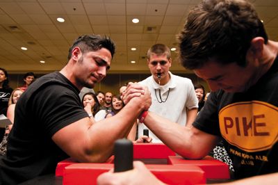 <strong>Alex Yee | Photography Intern</strong><br/> Senior Ali Reza Tehranian claims one of the championship titles at “Flex Your Muscles for Haiti.”