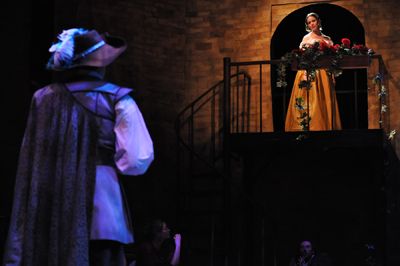 nikki jee | Staff Photographer Cyrano  (Ryan Imhoff) tries to woo the beautiful Roxanne (Nicole Erb), a la “Romeo and Juliet.”