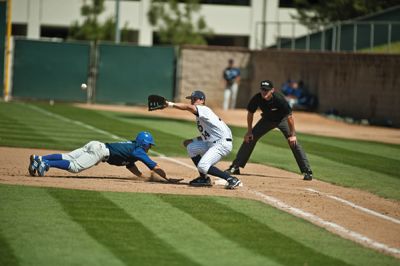 scott roeder | Staff Photographer Jeff Cusick takes the throw from Eric Pettis checking on the runner at first. UC Irvine won the game 9-6.