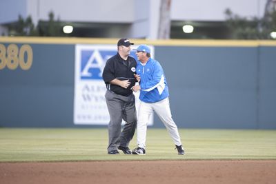 scott roeder | Staff Photographer Bruins coach John Savage argues with the umpire, getting ejected.