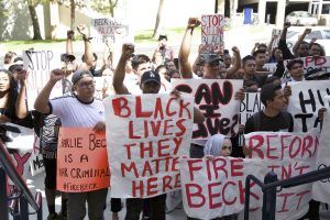 Protesters rally outside Student Center where LAPD Chief Beck gives talk.