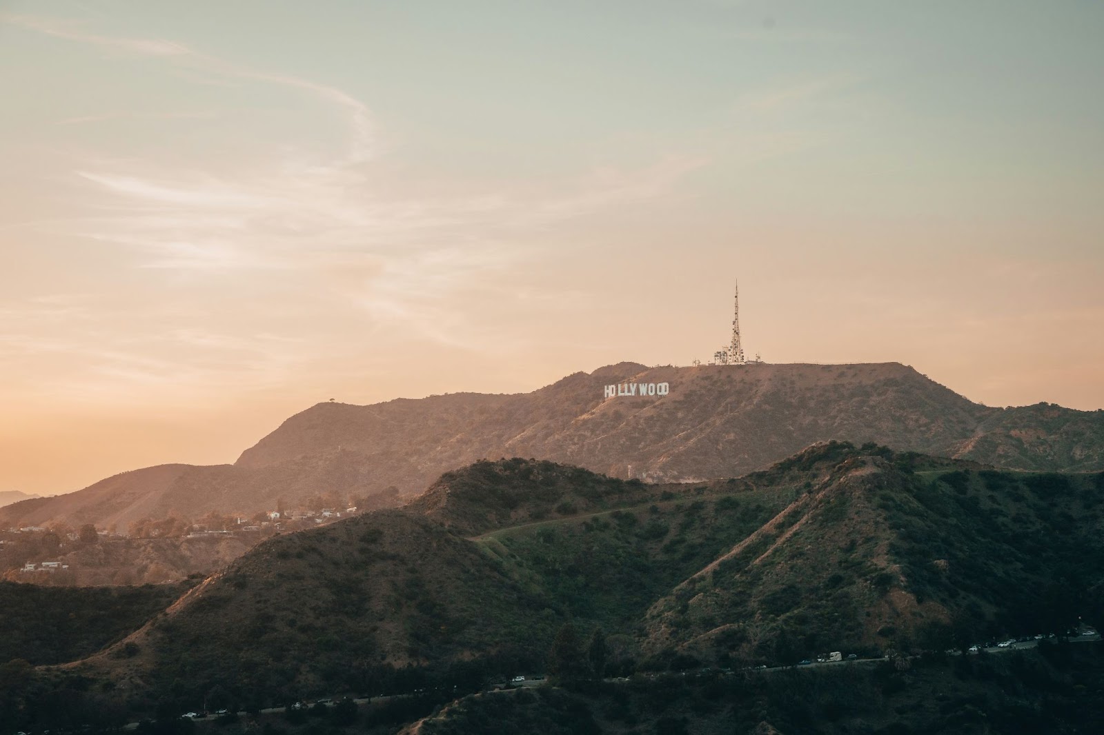 A photo of the Hollywood sign with the sun setting.