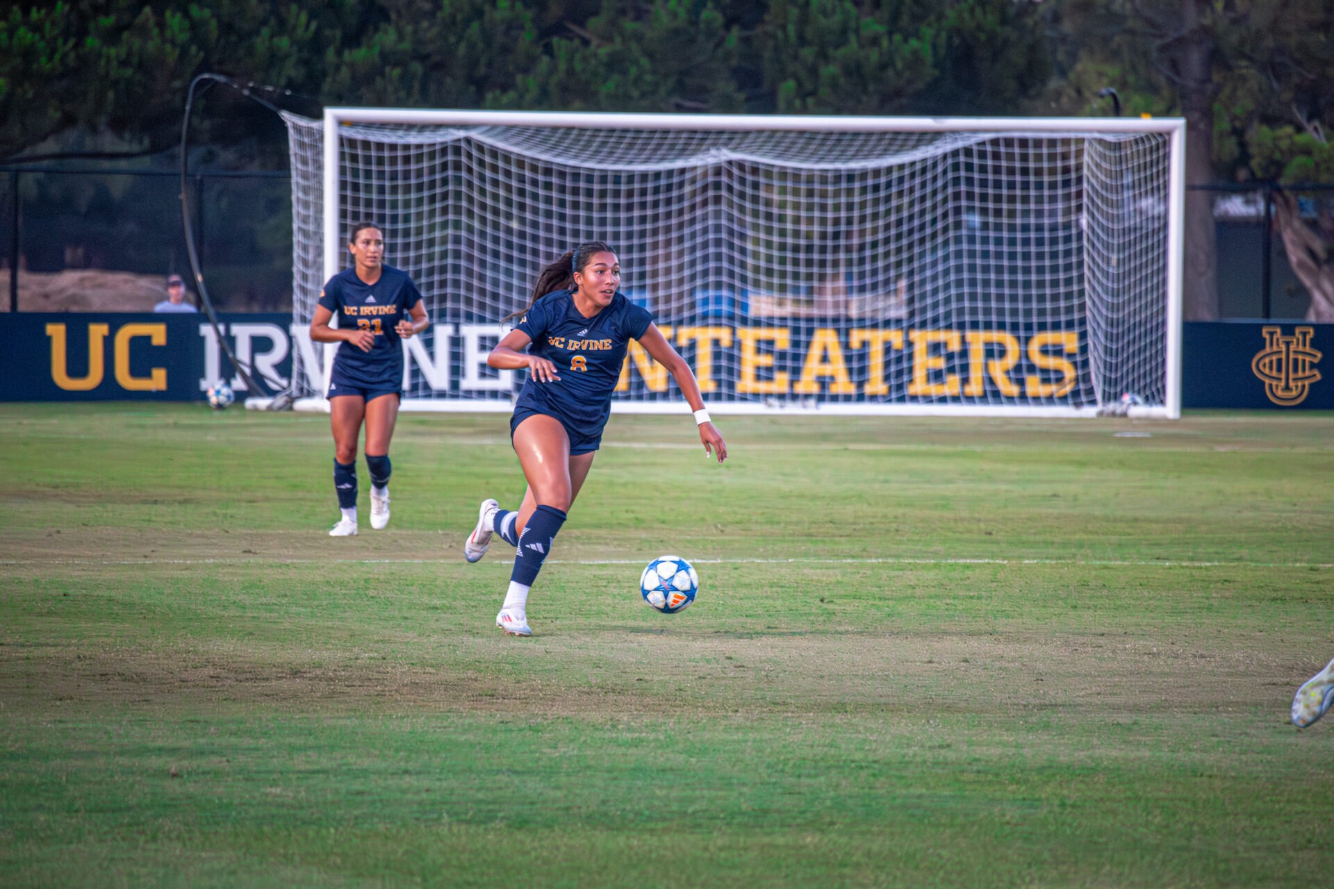 Number 8 dribbling with the ball.