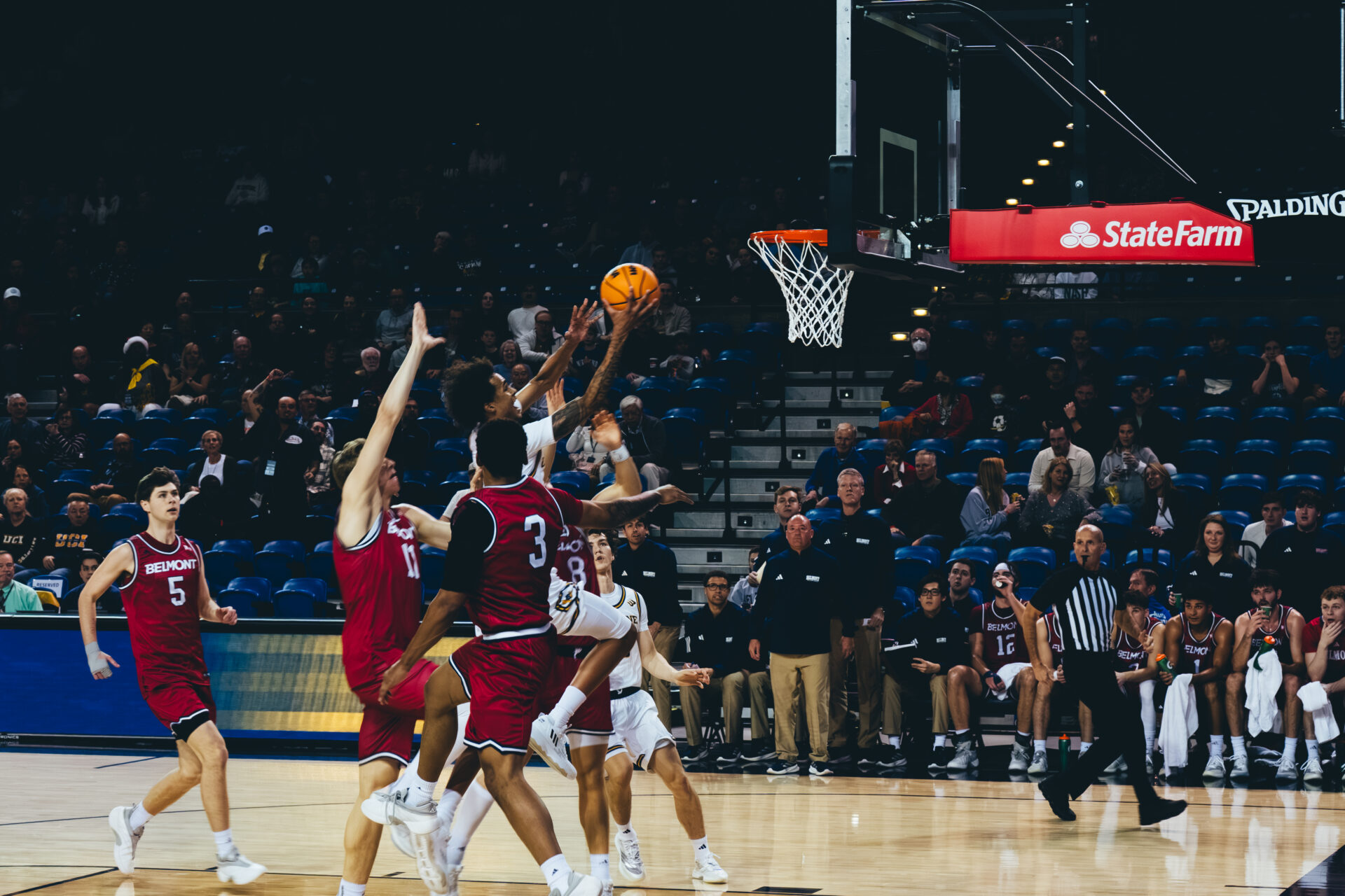 Elijah Chol driving for layup.