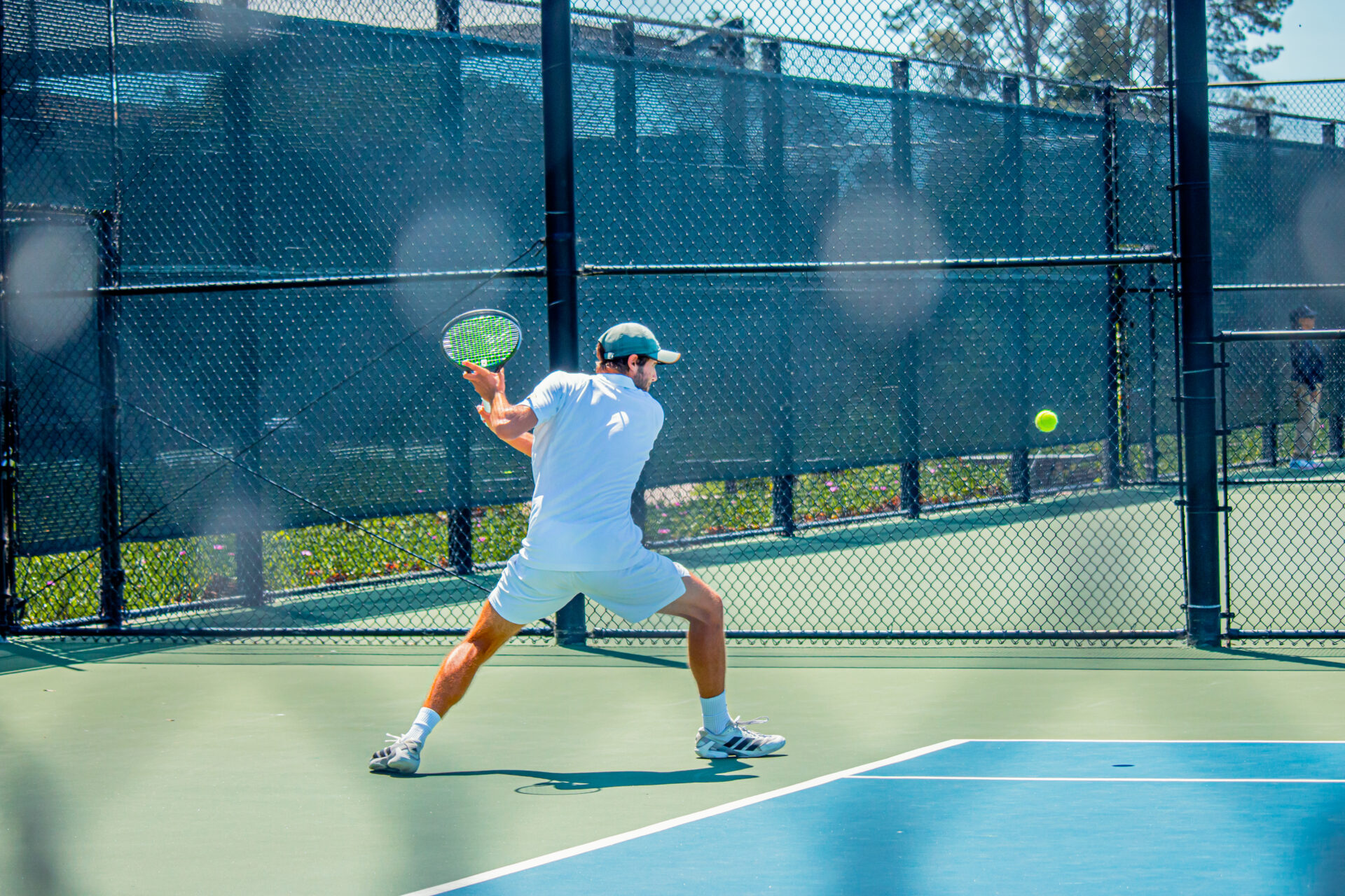 Player swinging racket.