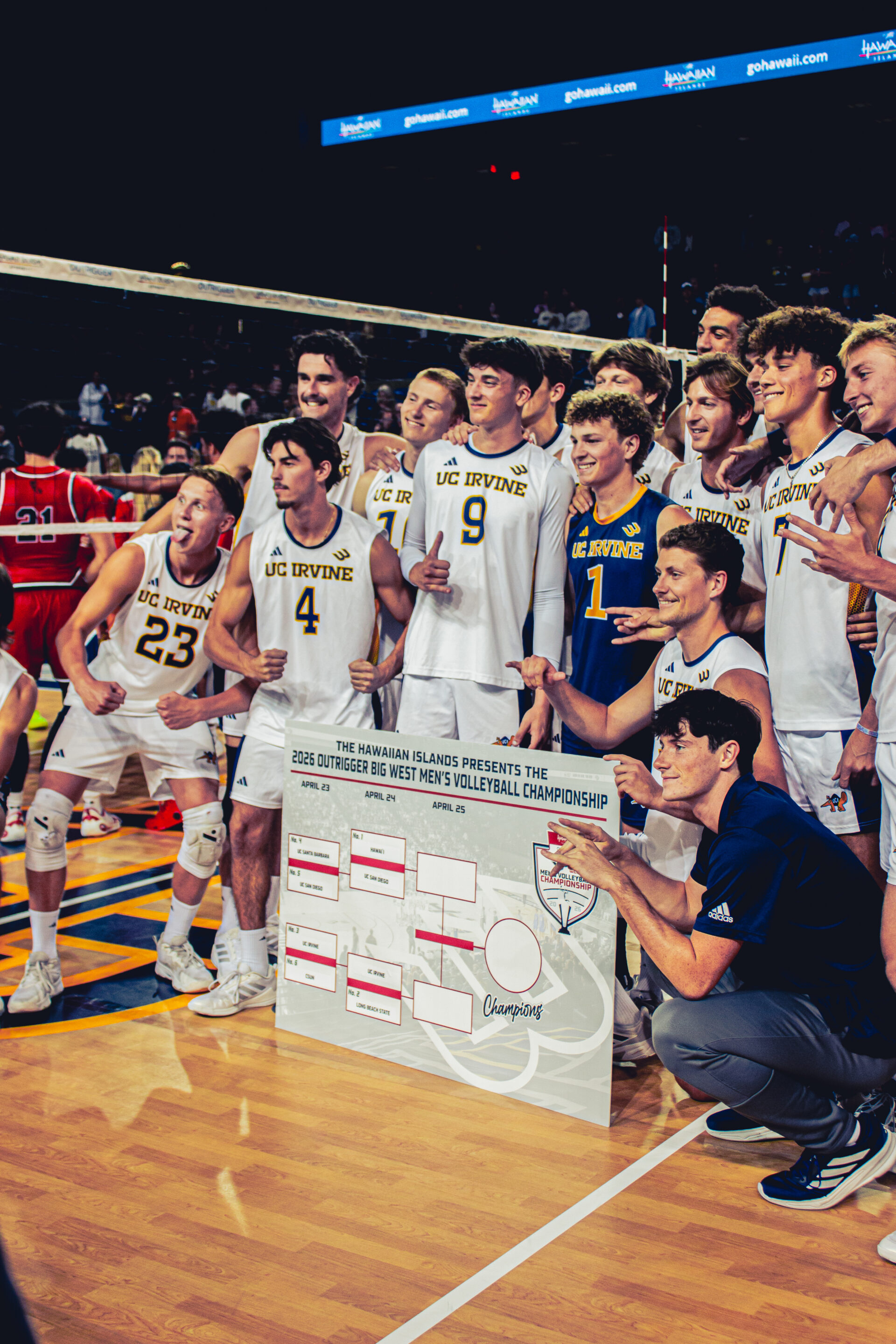 Players posing with a big poster showing the bracket.