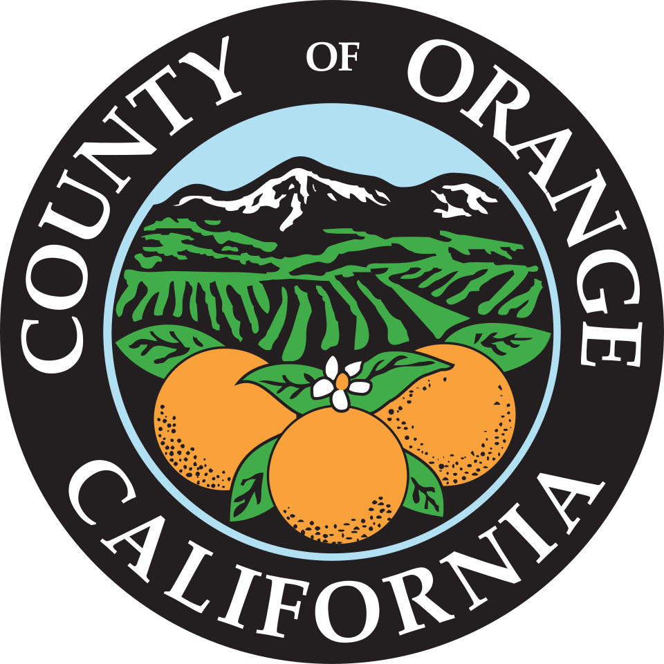 Photo shows the official seal of Orange County. In the middle is an illustration of three oranges against a backdrop of fields and mountains. 