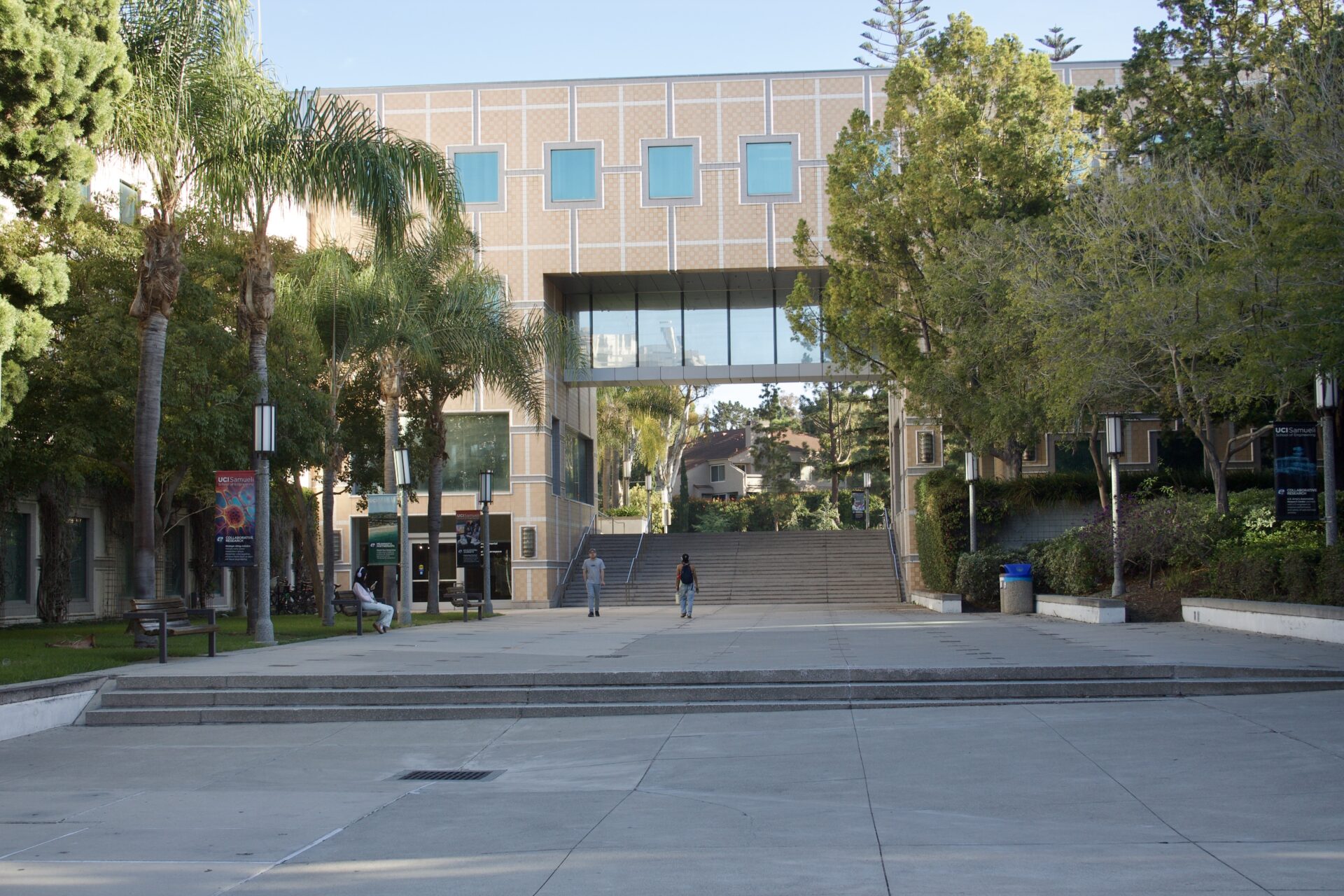 A large promenade is pictured with a few students walking through.