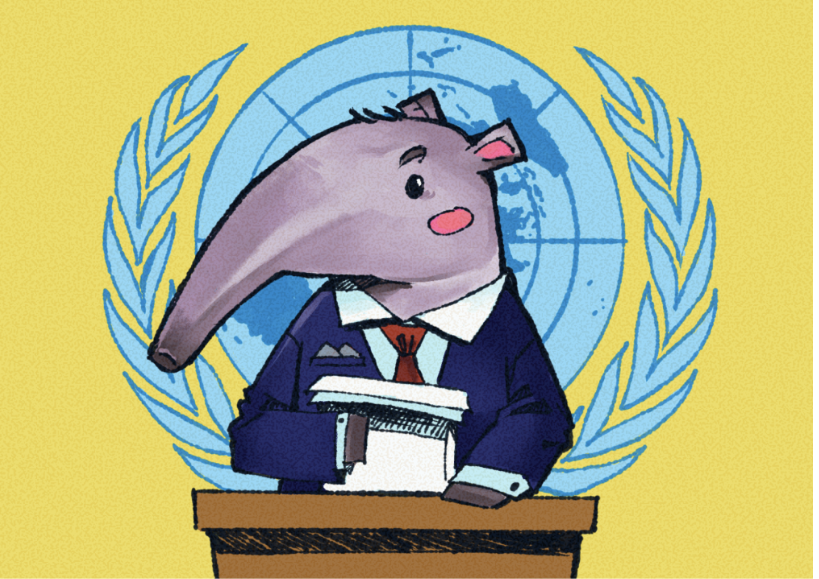 A cartoony light purple anteater in a blue suit with a red tie stands at a podium while holding two papers in their right hand. Behind them is the United Nations symbol in light blue on a solid yellow background.