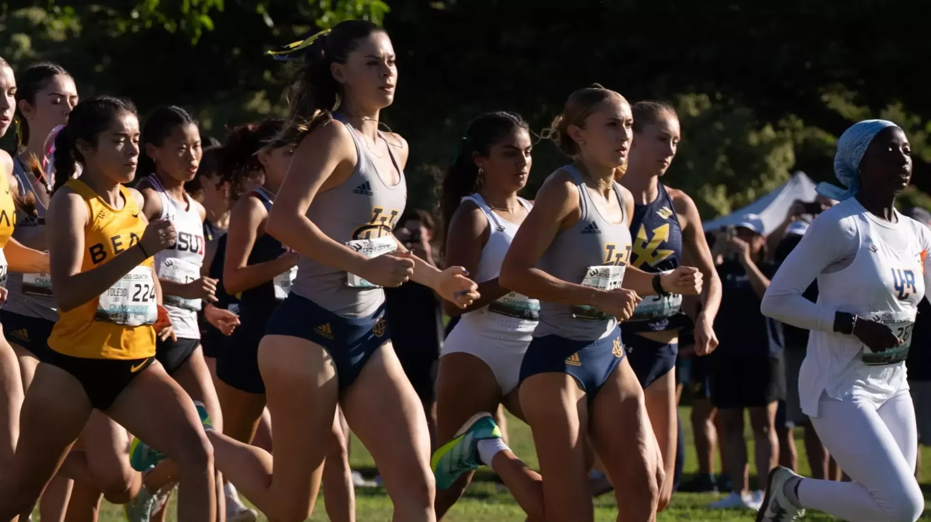 Multiple runners from UC Irvine, UC San Diego, UC Riverside, Long Beach State and CSUN run with Big West Championship bibs