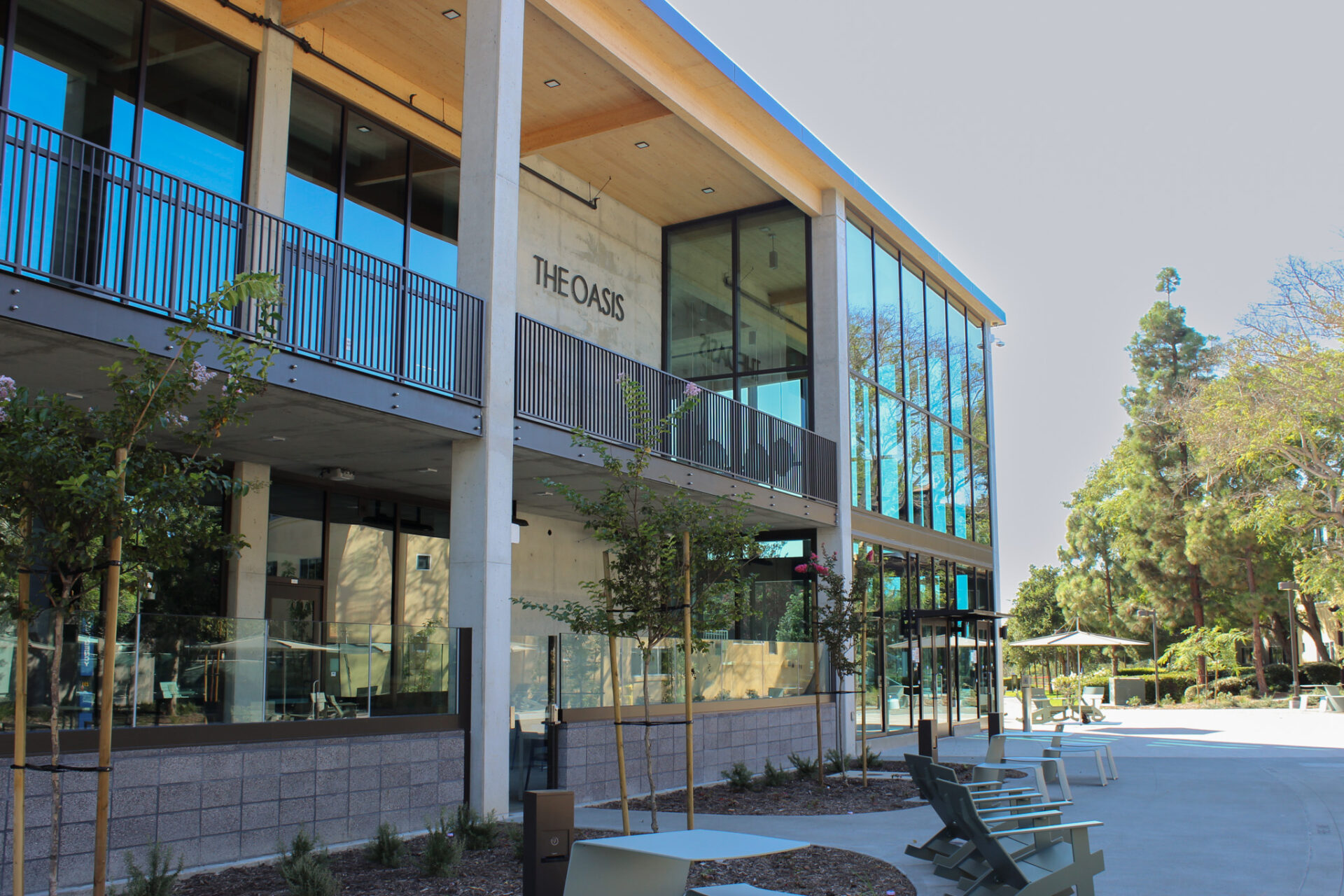 Picture shows the new Mesa Court community center. The exterior is made up of glass windows with 