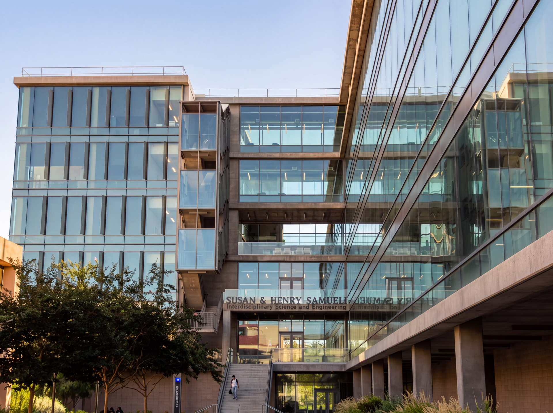 Photo shows building with glass walls. 